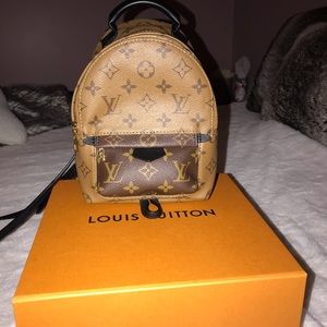 Palm Springs mini back pack reverse monogram